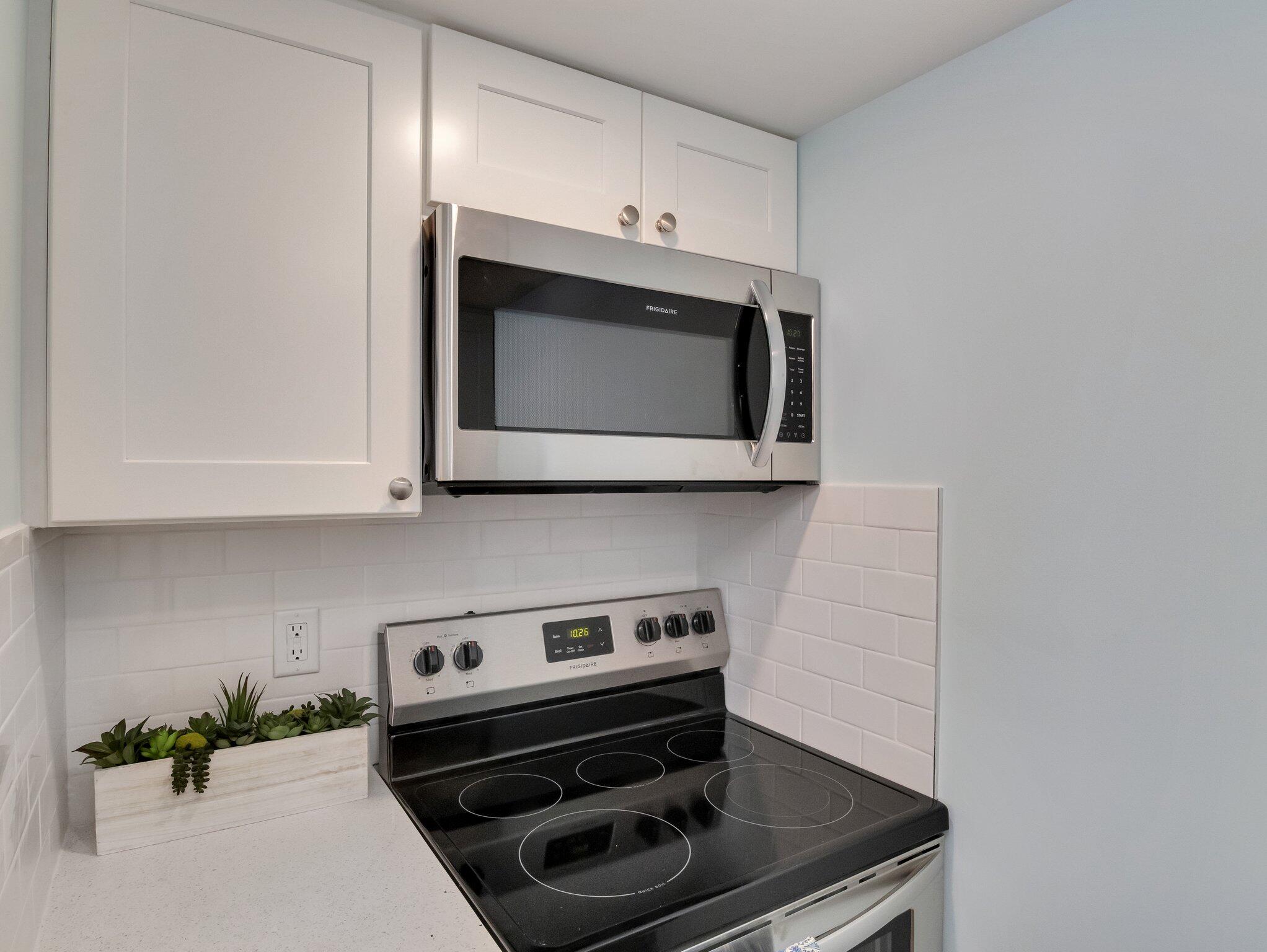 10 Heintz Road Dennis Port, MA 02639 - Photo 7 of 15 a kitchen with a stove and a microwave