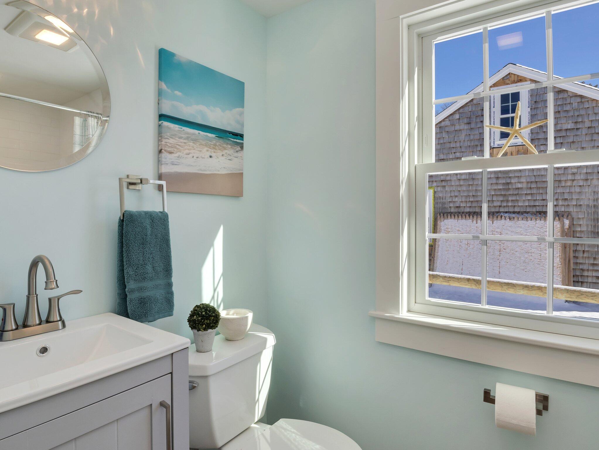 10 Heintz Road Dennis Port, MA 02639 - Photo 8 of 15 a bathroom with a sink a toilet and mirror