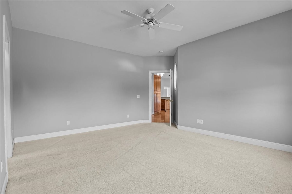 2440 Maple Grove Road Dickson, TN 37055 - Photo 22 of 99 an empty room with closet and a ceiling fan
