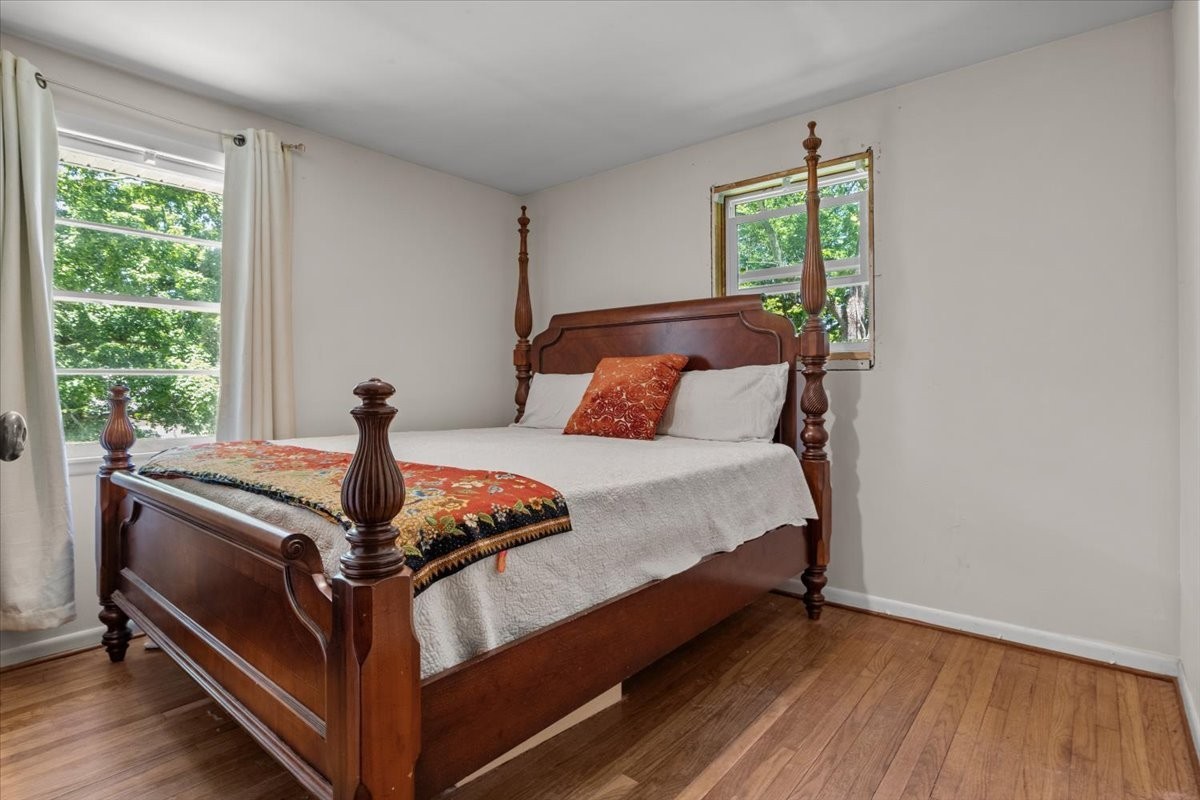 2440 Maple Grove Road Dickson, TN 37055 - Photo 64 of 99 a bed sitting in a bedroom next to a window