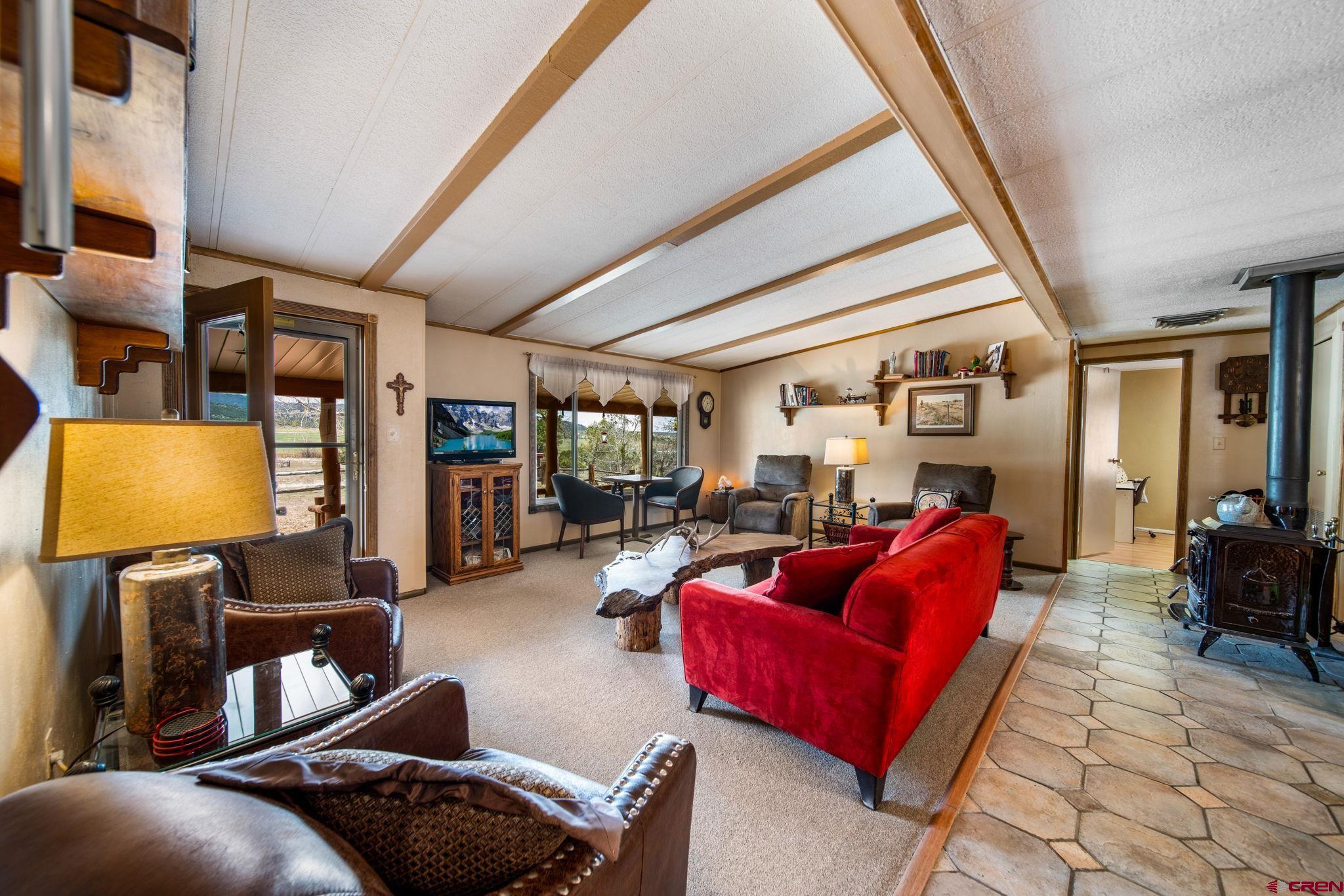 7853 County Road 334 Ignacio, CO 81137 - Photo 12 of 39 a living room with furniture a couch and a potted plant