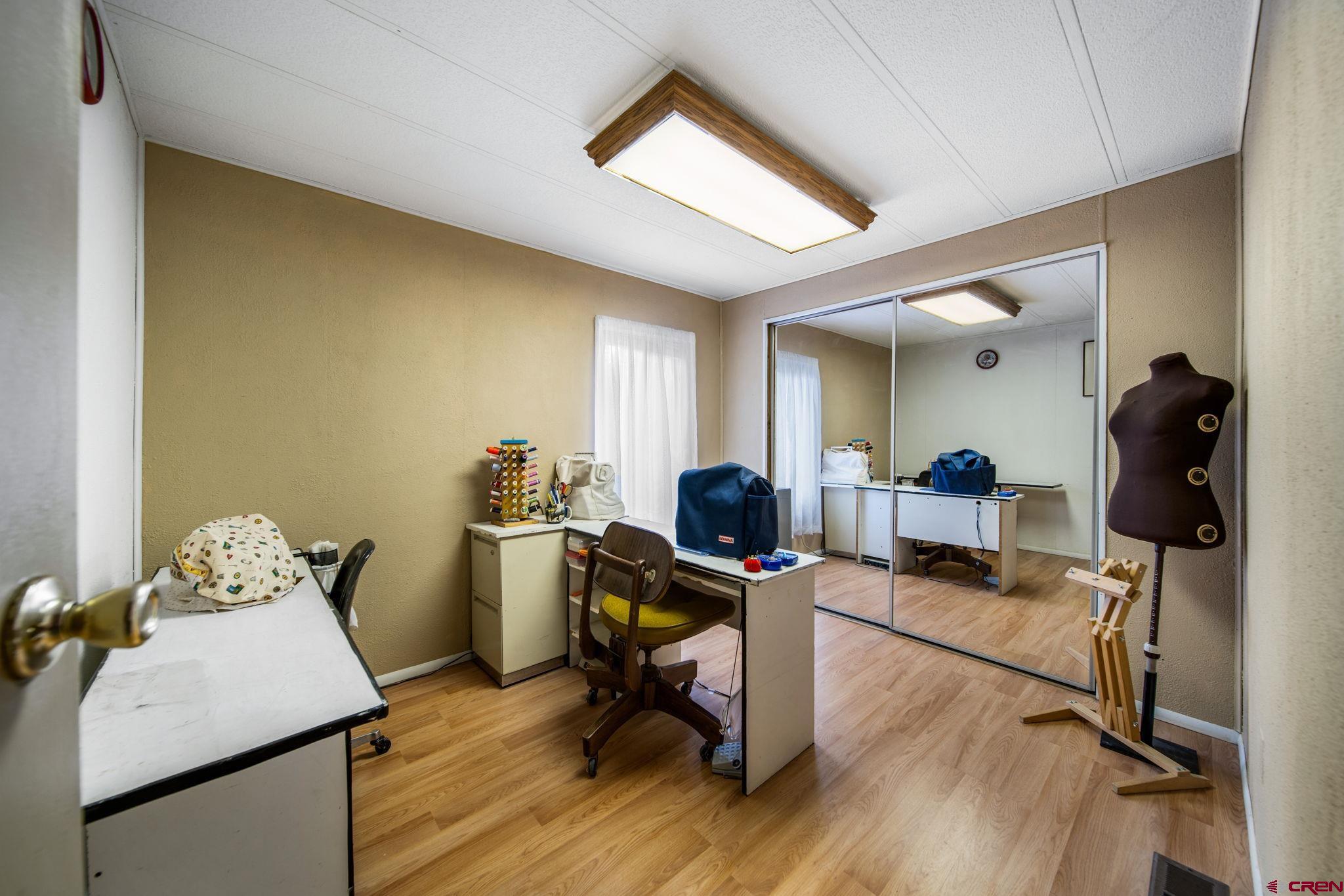 7853 County Road 334 Ignacio, CO 81137 - Photo 16 of 39 a view of a workspace with furniture and a window