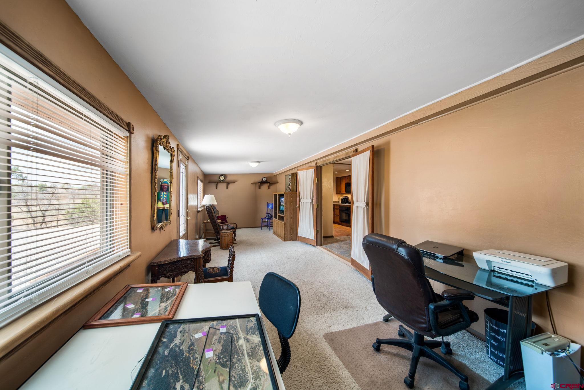 7853 County Road 334 Ignacio, CO 81137 - Photo 22 of 39 a room with furniture and a large window