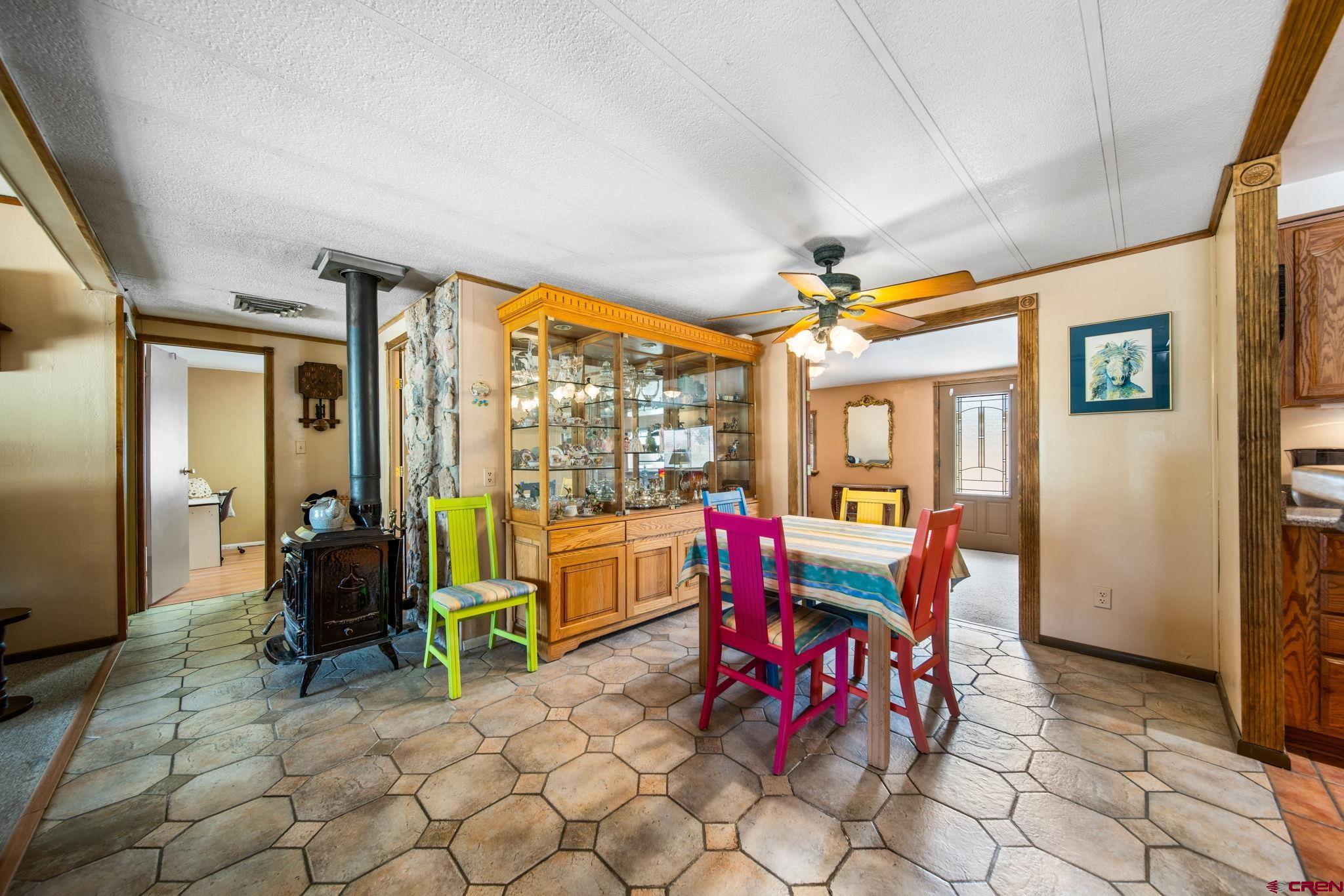 7853 County Road 334 Ignacio, CO 81137 - Photo 24 of 39 a dining room with furniture large windows and wooden floor