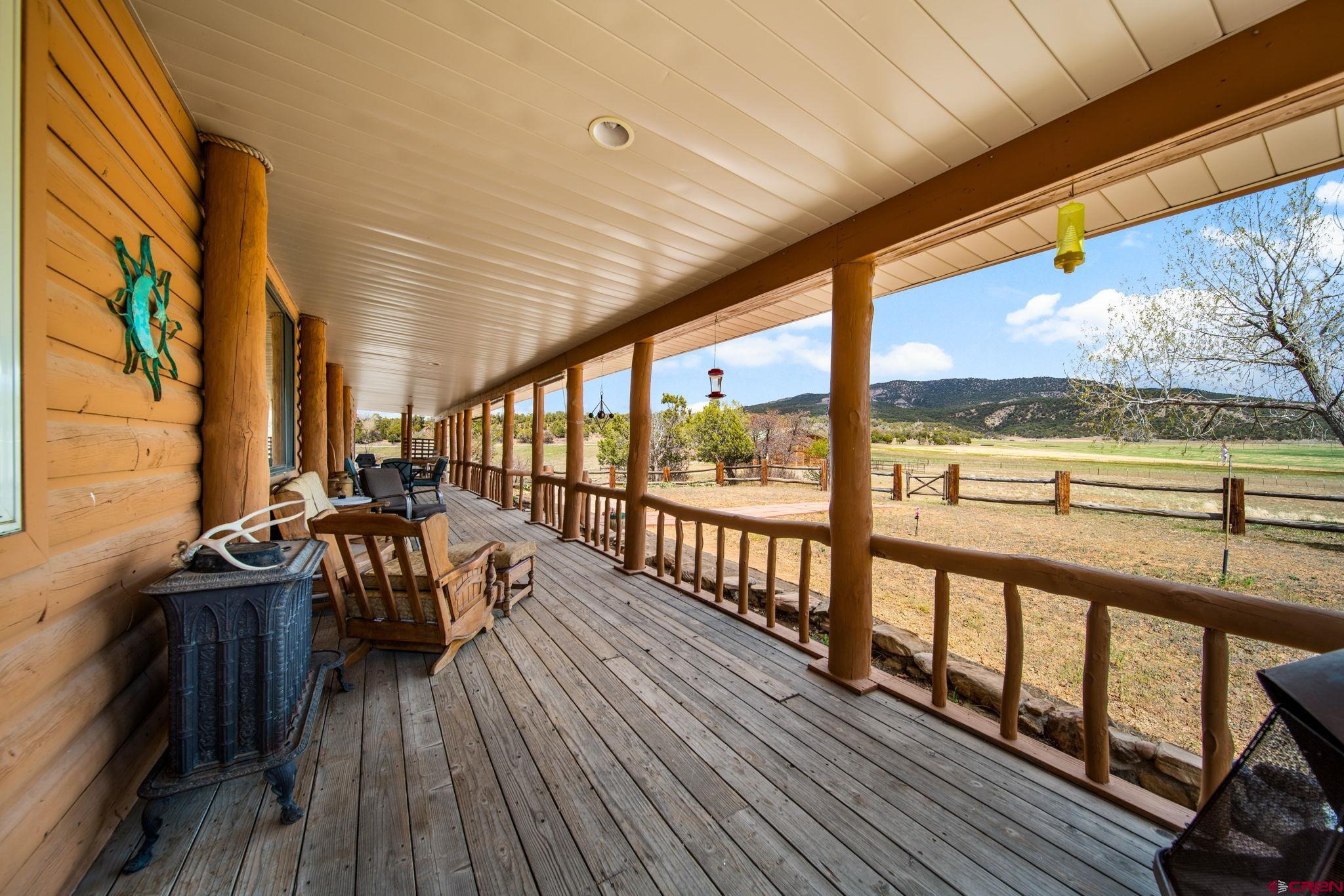 7853 County Road 334 Ignacio, CO 81137 - Photo 25 of 39 a view of a balcony with chairs and wooden floor