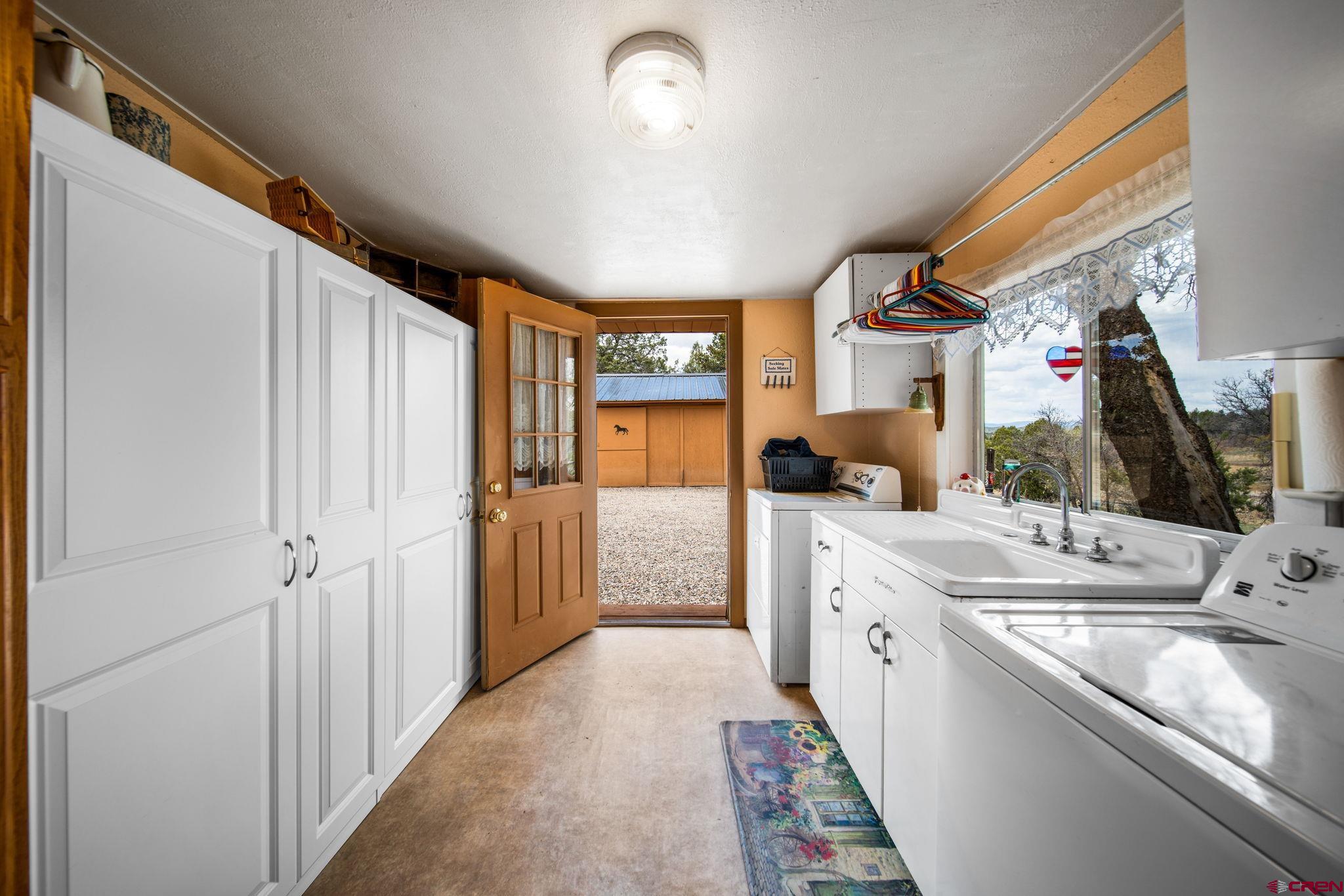 7853 County Road 334 Ignacio, CO 81137 - Photo 9 of 39 a bathroom with a sink a mirror and a shower