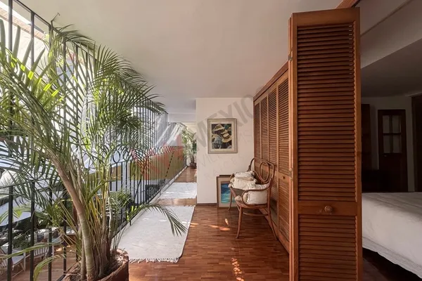 a bedroom with a bed and a table