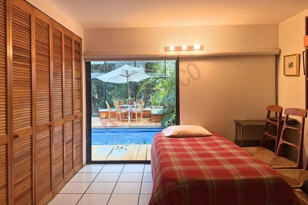 a view of staircase with lots of frames on wall and a glass door