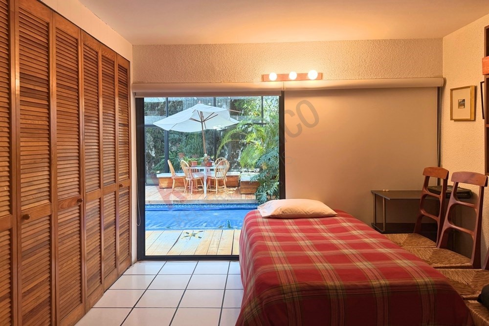 36 Perugino Bath, undefined 03740 - Photo 20 of 29 a bedroom with a bed and a table