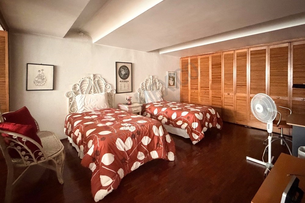 36 Perugino Bath, undefined 03740 - Photo 24 of 29 a bedroom with a bed mirror and a large window