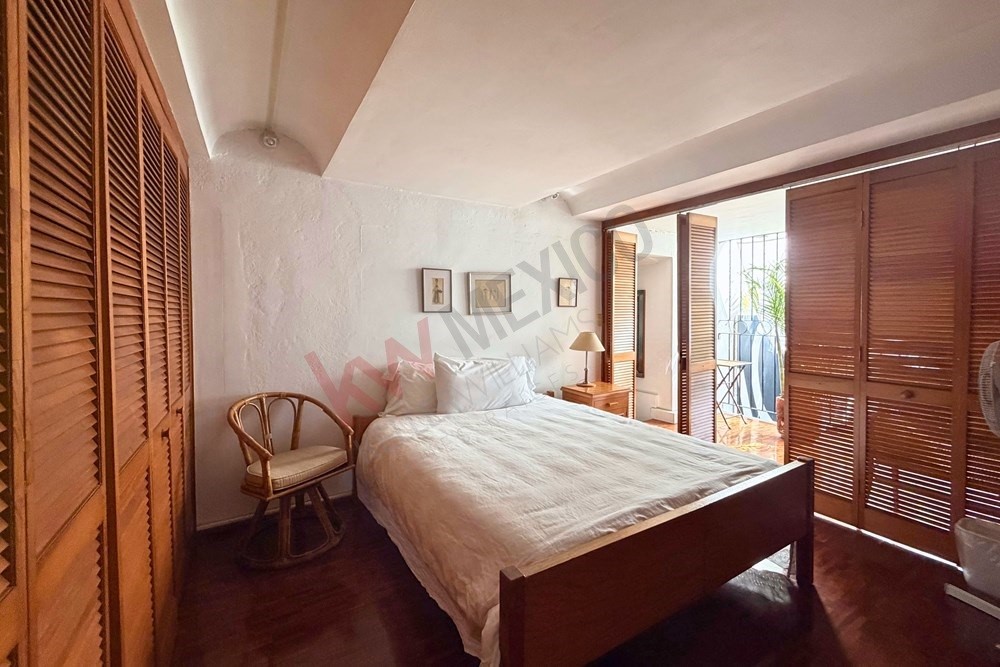 36 Perugino Bath, undefined 03740 - Photo 27 of 29 a bedroom with a bed and a table with chair