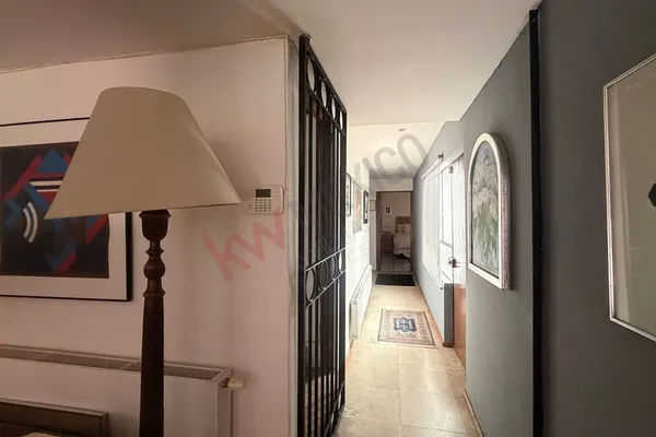 a view of a hallway view with staircase