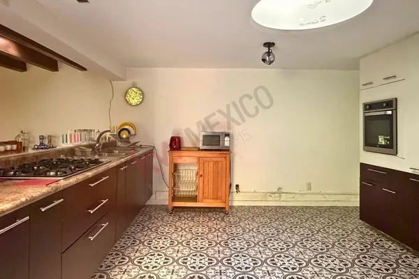 a kitchen with a sink and a stove