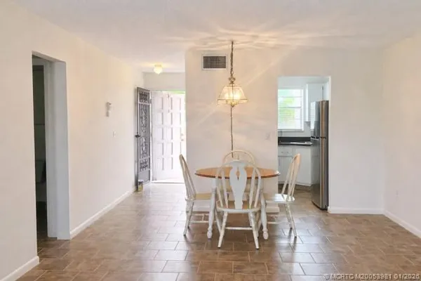 a view of a dining room with furniture
