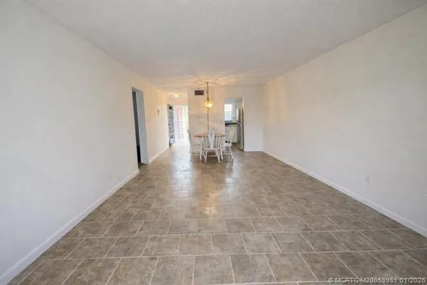 a view of a hallway with seating area