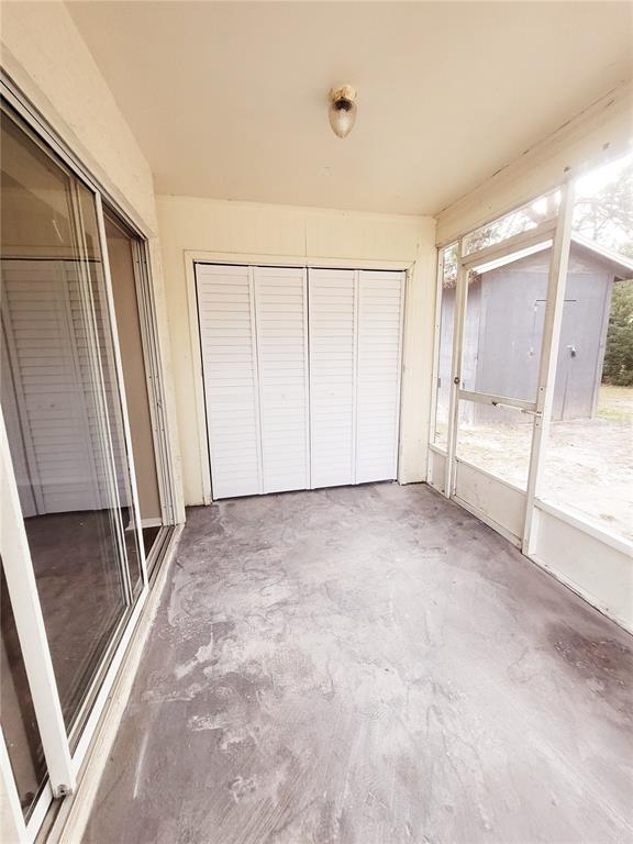 4331 Azora Road Spring Hill, FL 34608 - Photo 14 of 16 an empty room with windows
