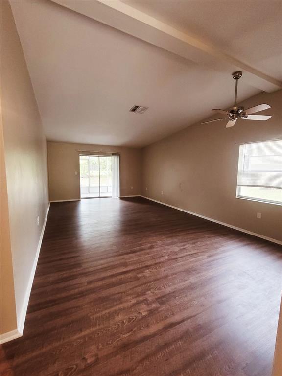 4331 Azora Road Spring Hill, FL 34608 - Photo 2 of 16 wooden floor in an empty room with a window