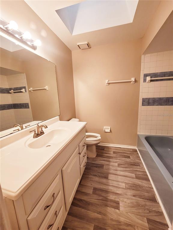 4331 Azora Road Spring Hill, FL 34608 - Photo 8 of 16 a bathroom with a sink and a mirror