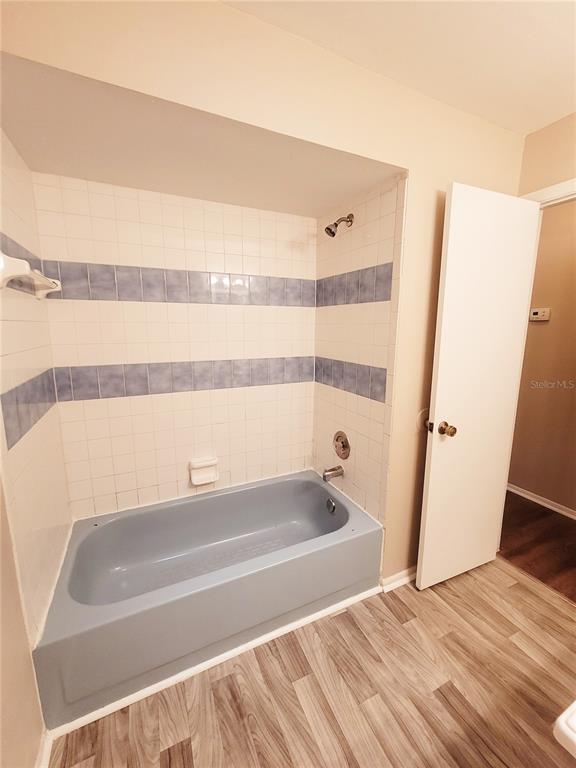 4331 Azora Road Spring Hill, FL 34608 - Photo 9 of 16 a bathroom with a bathtub and a shower