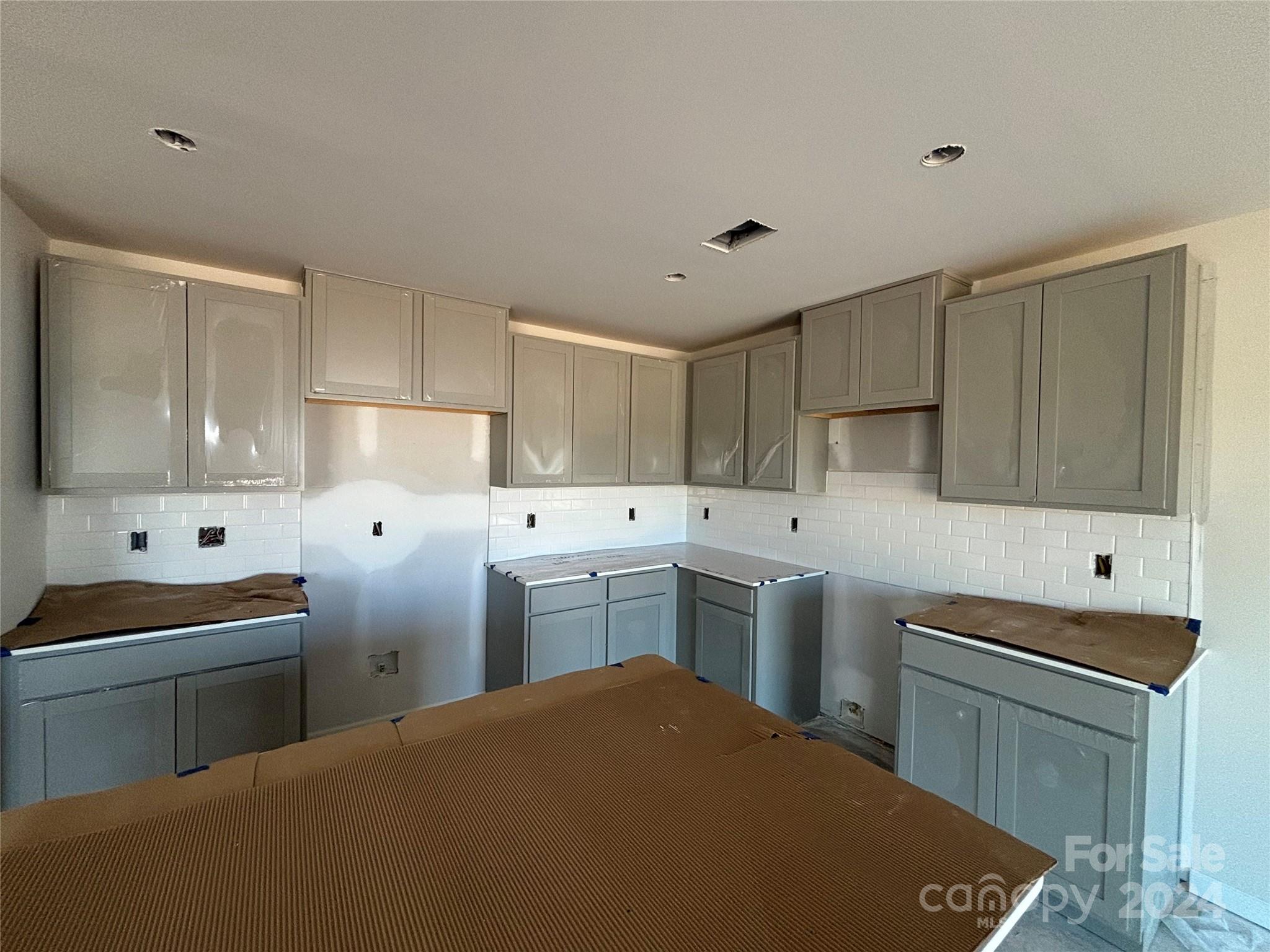 627 Mile Crk Road, Unit 69 Edgemoor, SC 29712 - Photo 2 of 16 a kitchen with a sink stove and cabinets