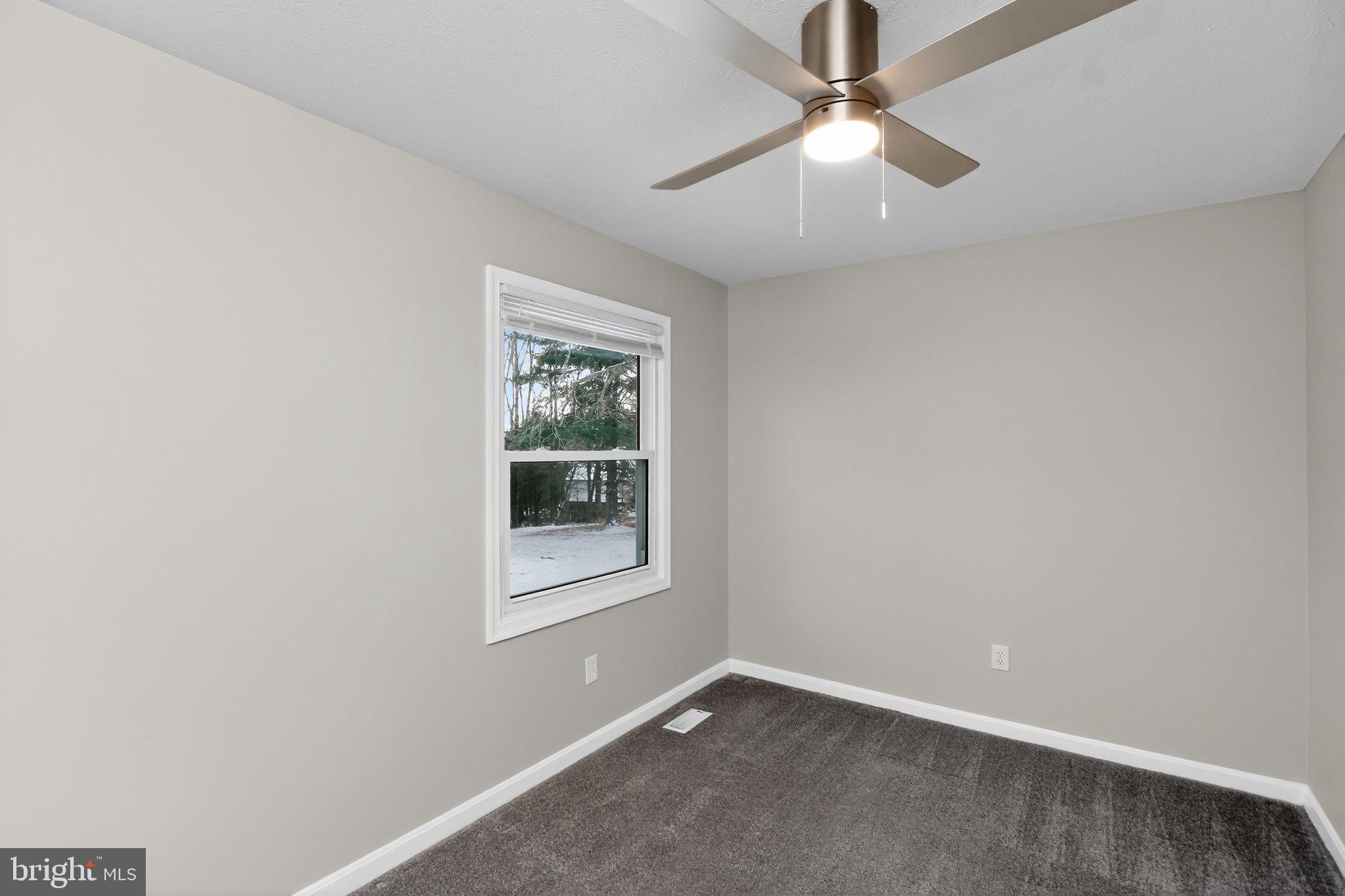 11979 Falling Creek Drive Manassas, VA 20112 - Photo 13 of 30 an empty room with a window and a fan