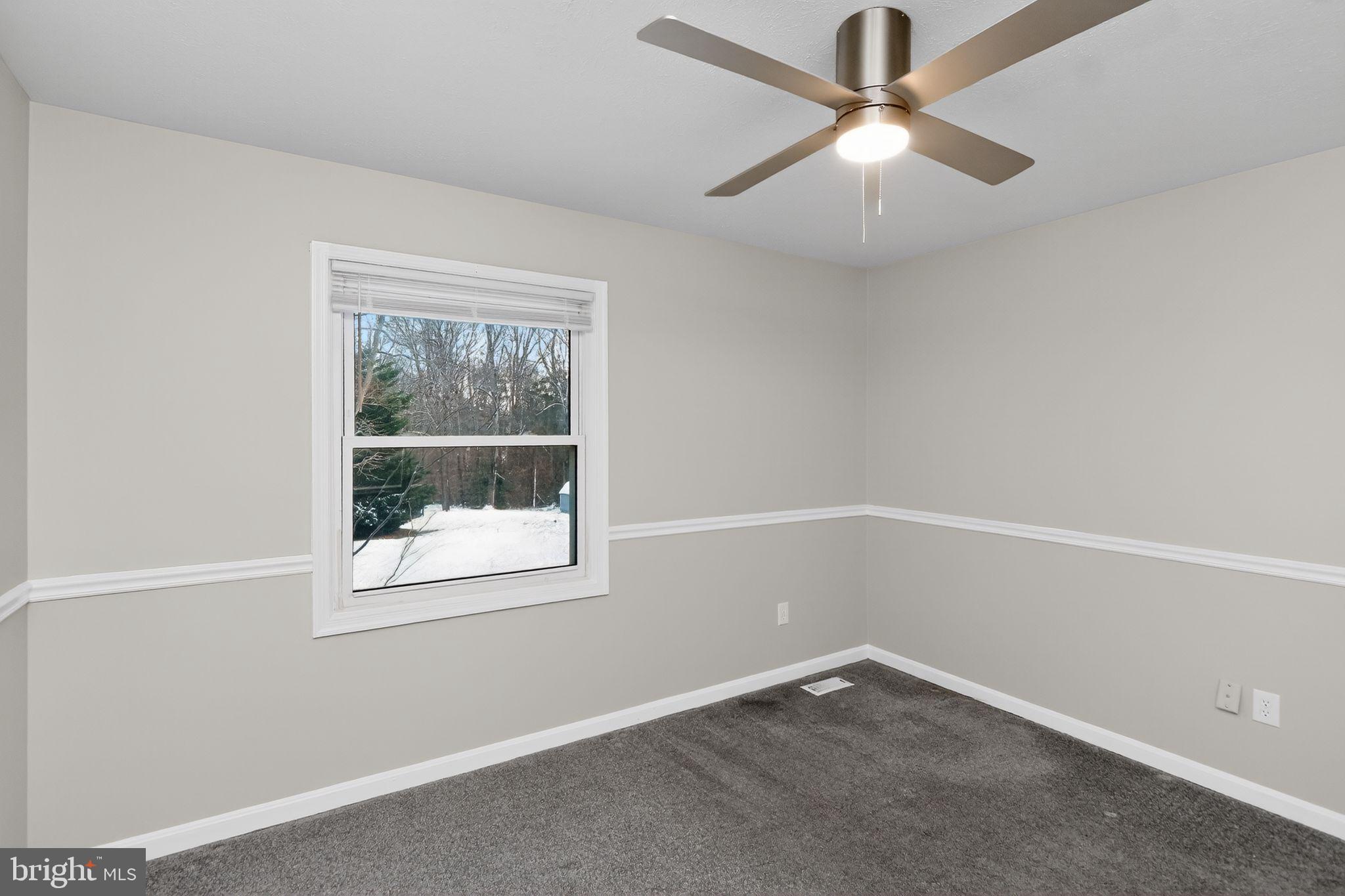 11979 Falling Creek Drive Manassas, VA 20112 - Photo 14 of 30 an empty room with a window and a fan