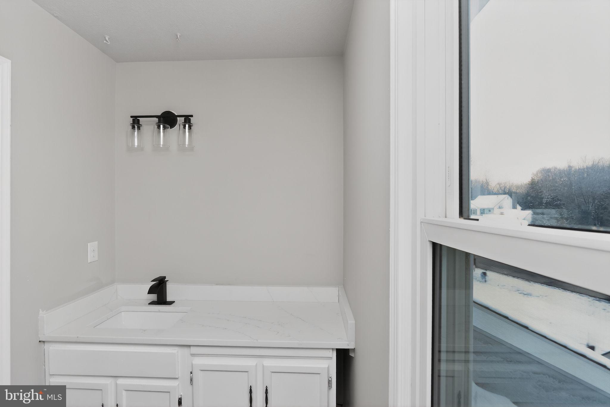 11979 Falling Creek Drive Manassas, VA 20112 - Photo 27 of 30 a bathroom with a sink