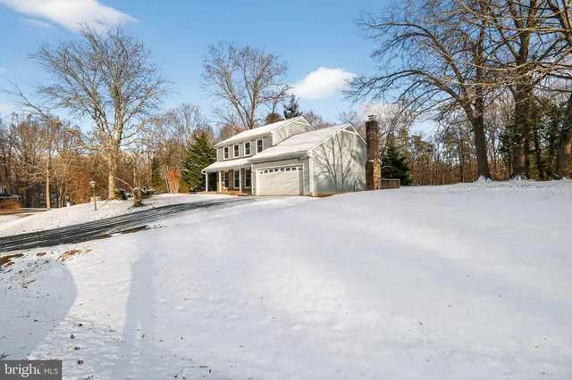 a view of a building with a snow in the yard