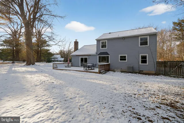 a view of a house with a snow in the yard