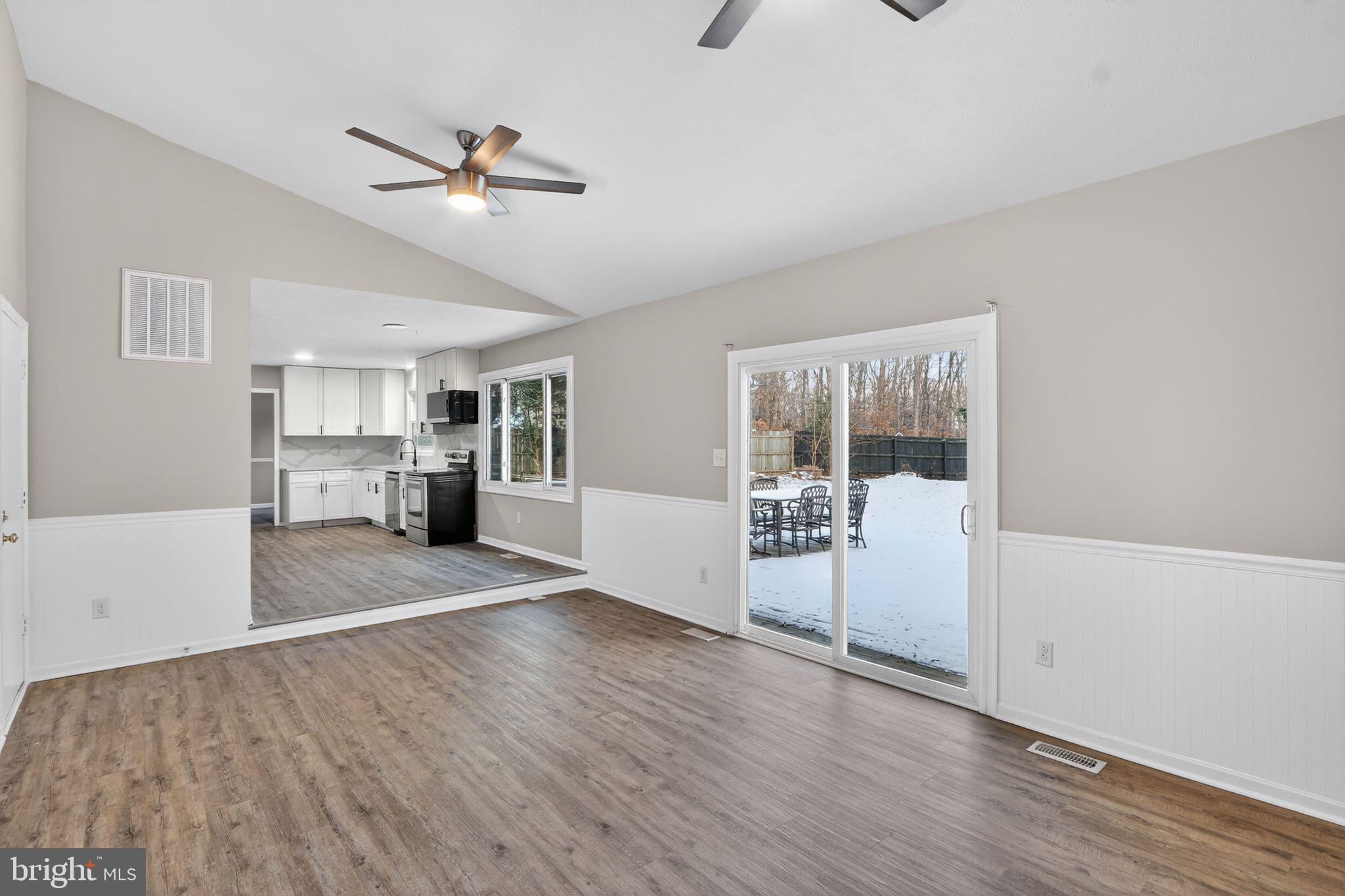 11979 Falling Creek Drive Manassas, VA 20112 - Photo 7 of 30 a view of empty room with wooden floor and fan