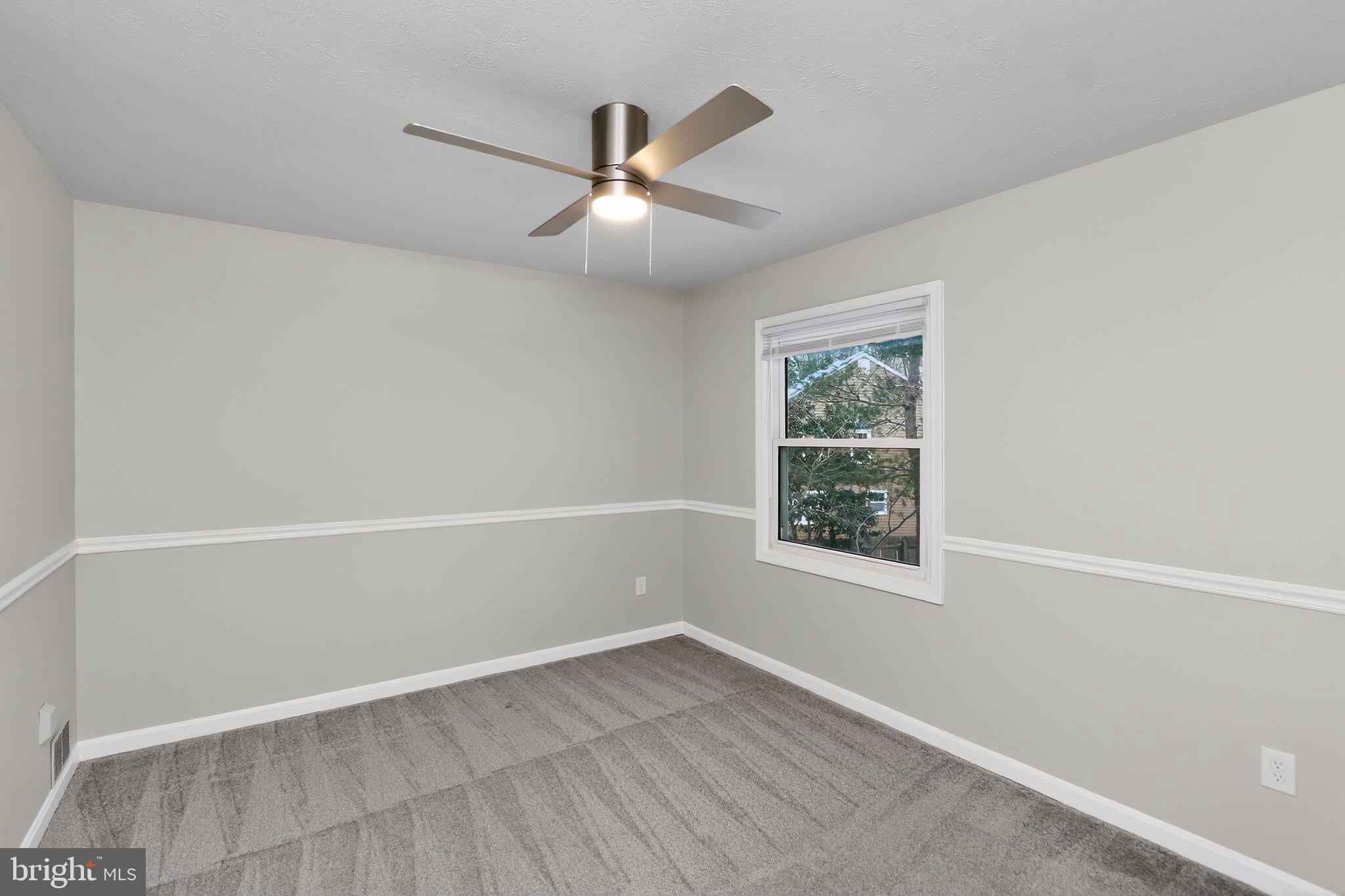 11979 Falling Creek Drive Manassas, VA 20112 - Photo 10 of 30 an empty room with a window and a fan