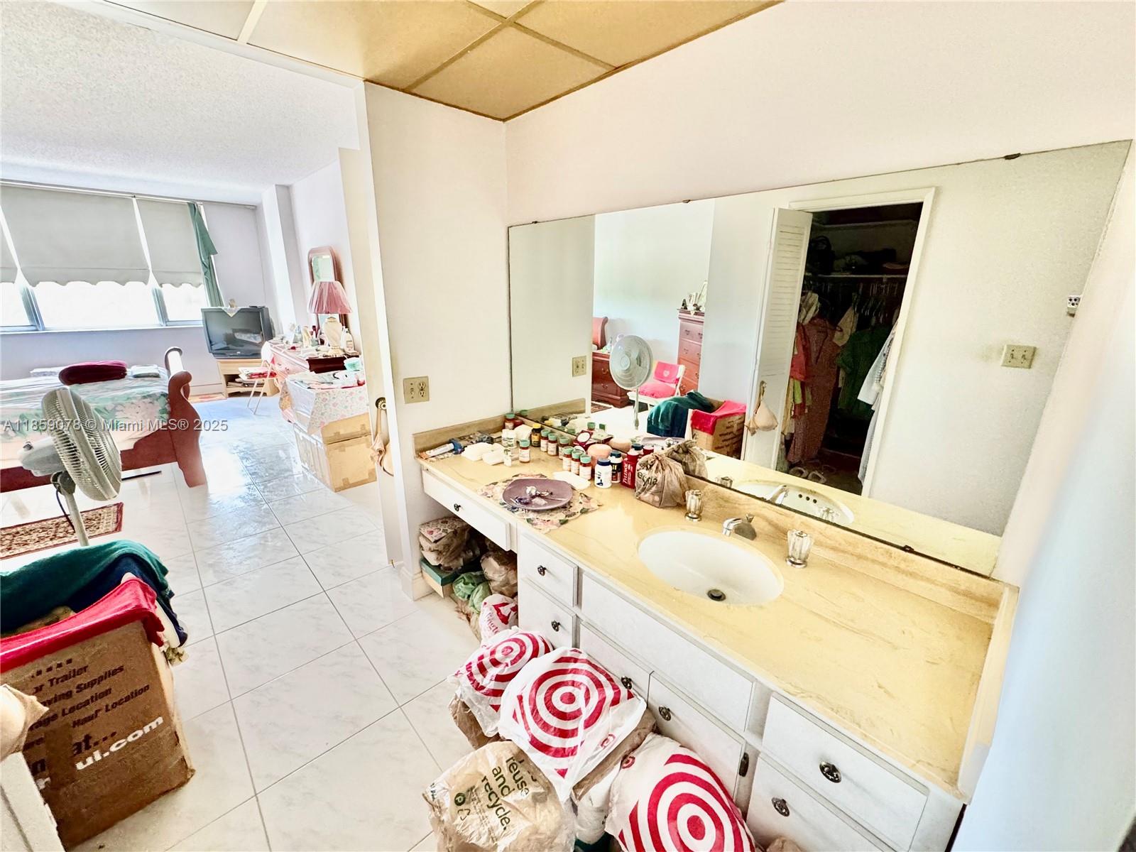4400 Hillcrest Drive, Unit 520C Hollywood, FL 33021 - Photo 12 of 18 a bathroom with a sink and a mirror