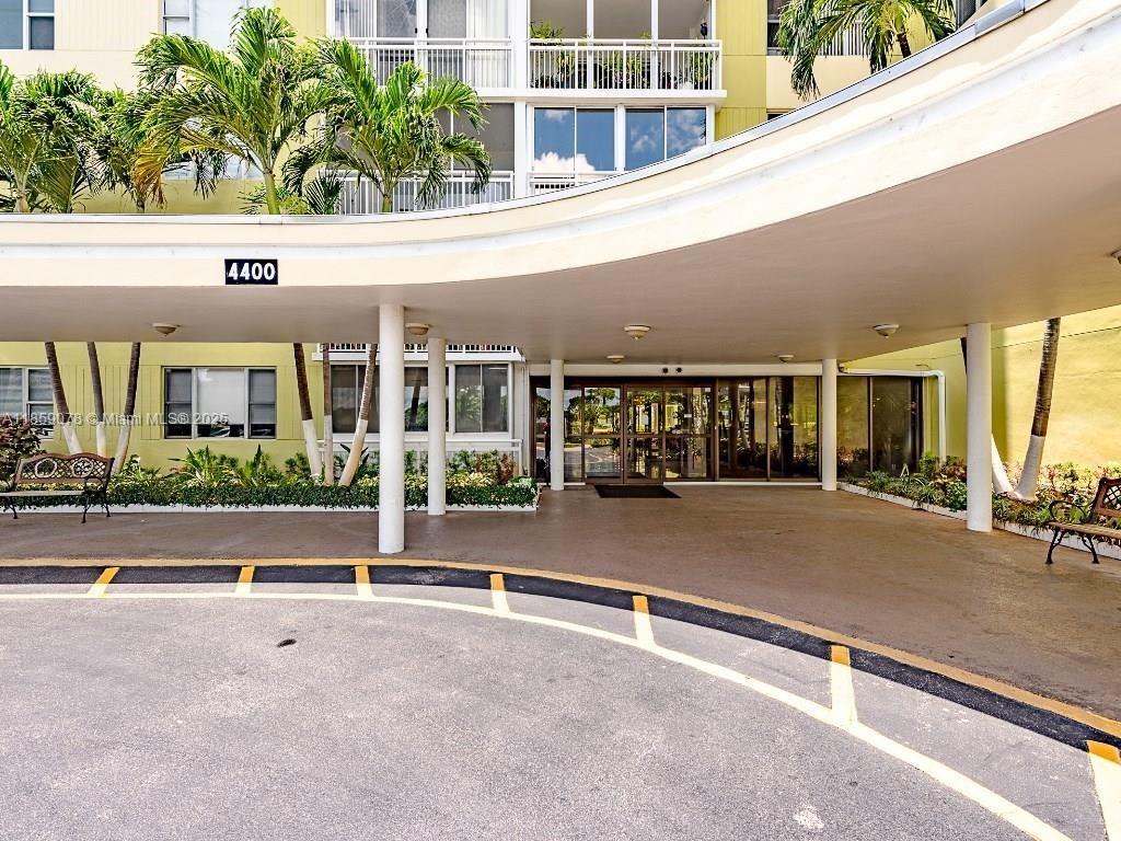 4400 Hillcrest Drive, Unit 520C Hollywood, FL 33021 - Photo 3 of 18 a view of building with car parked