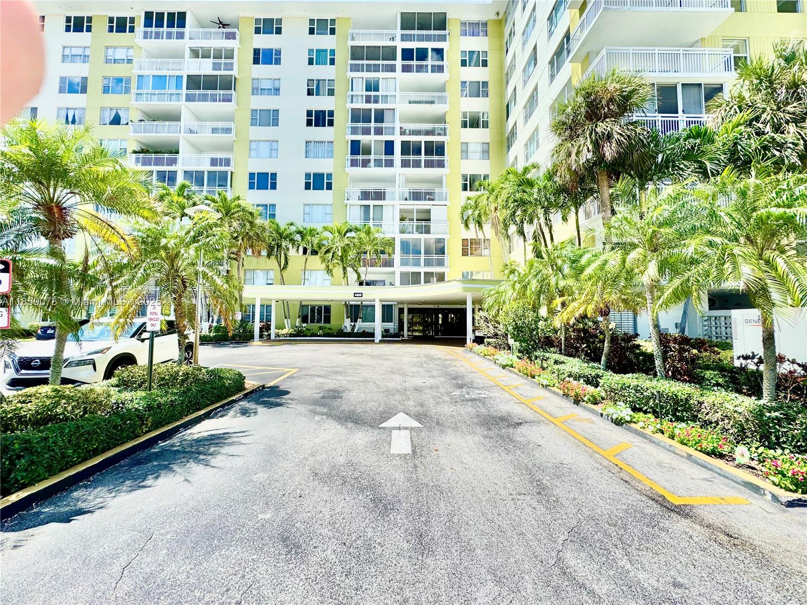 4400 Hillcrest Drive, Unit 520C Hollywood, FL 33021 - Photo 4 of 18 a building with a garden area
