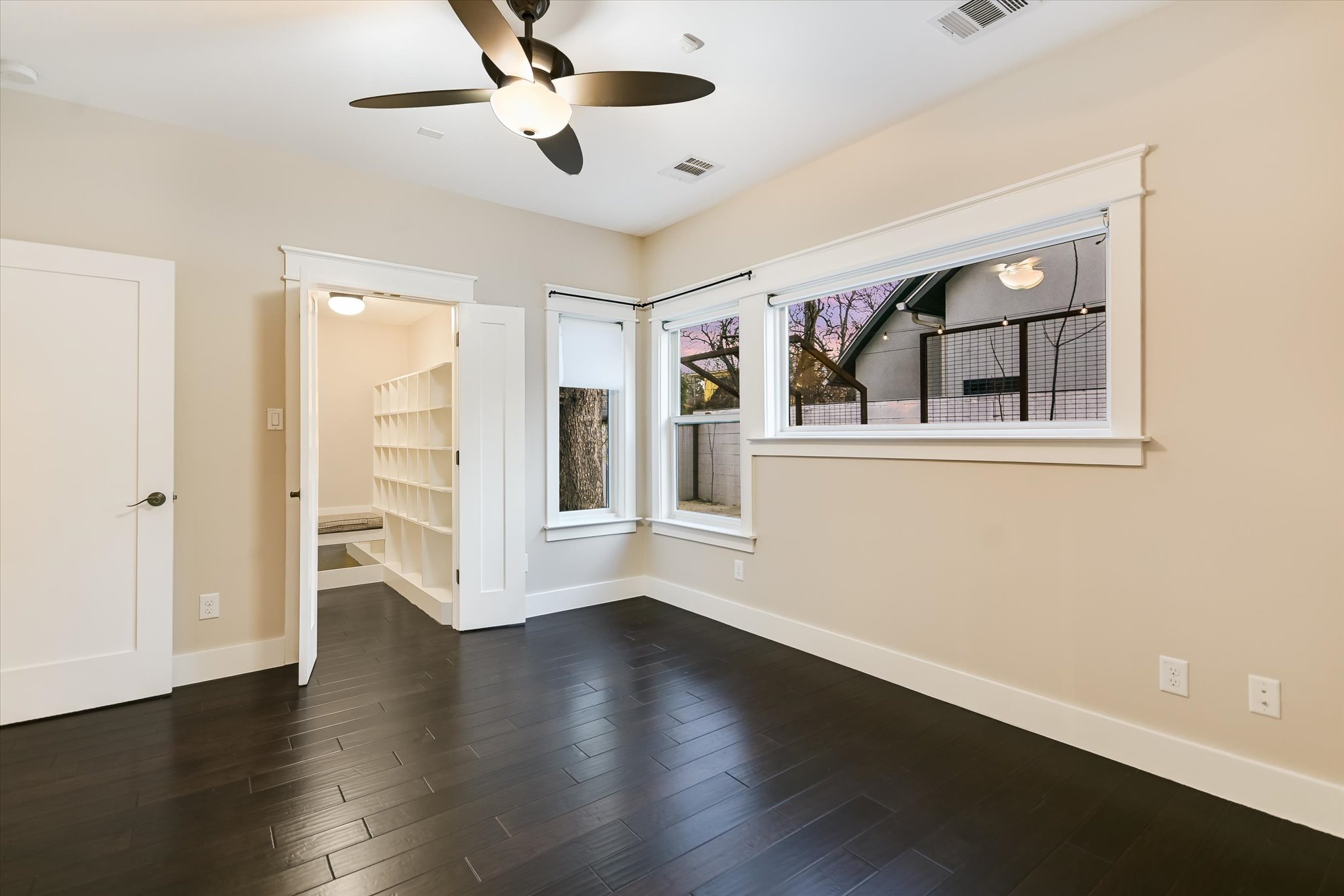 1613 Willow Street Austin, TX 78702 - Photo 13 of 30 a view of empty room with wooden floor and fan