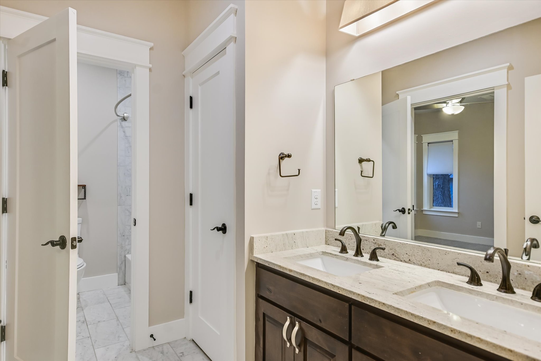 1613 Willow Street Austin, TX 78702 - Photo 19 of 30 a bathroom with a granite countertop sink mirror and double