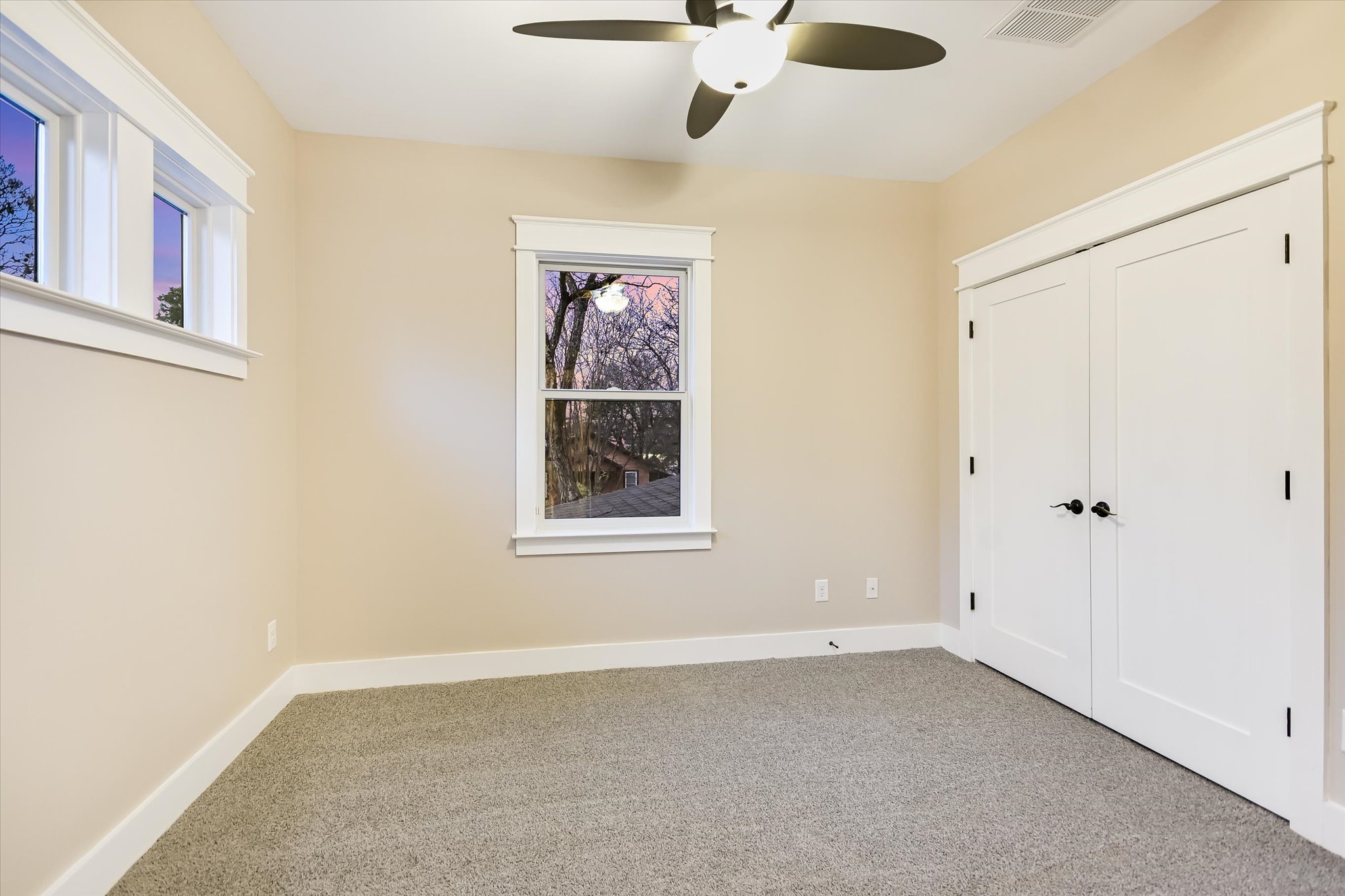 1613 Willow Street Austin, TX 78702 - Photo 21 of 30 an empty room with windows and fan