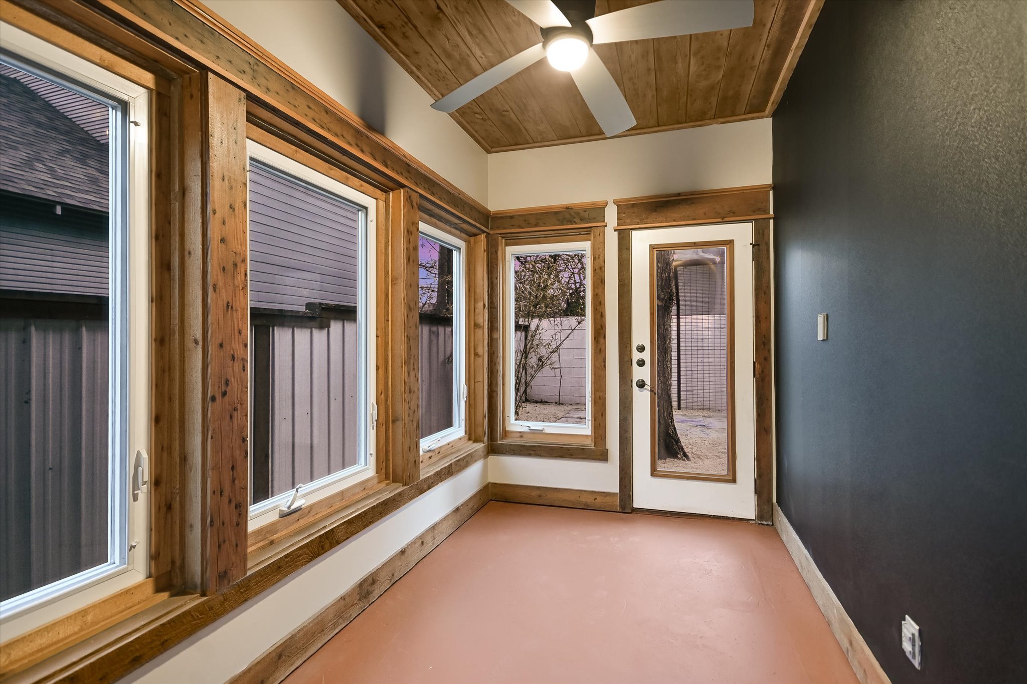1613 Willow Street Austin, TX 78702 - Photo 22 of 30 a view of a hallway with a glass door and furniture
