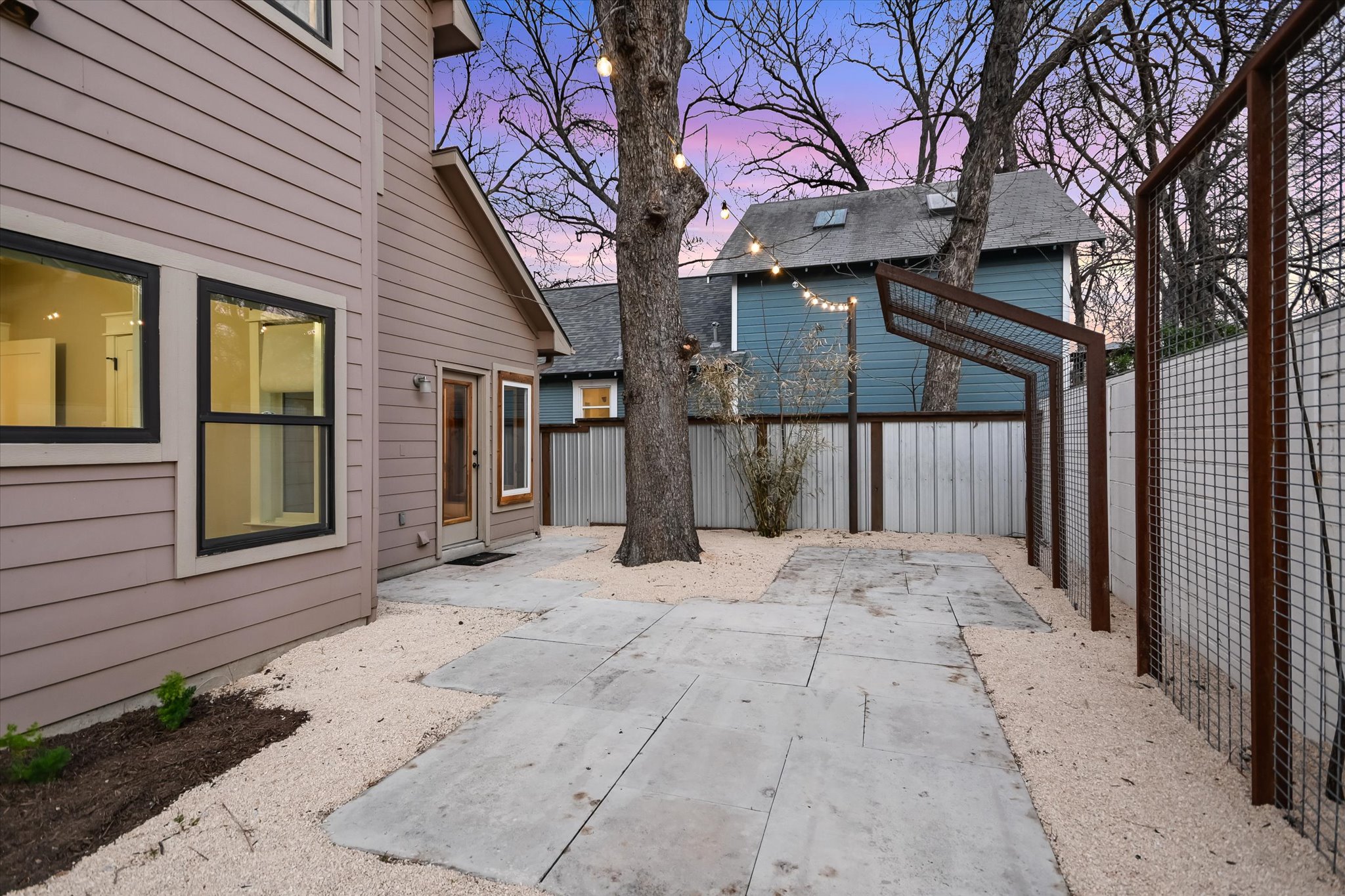 1613 Willow Street Austin, TX 78702 - Photo 24 of 30 a view of a house with a snow in the yard