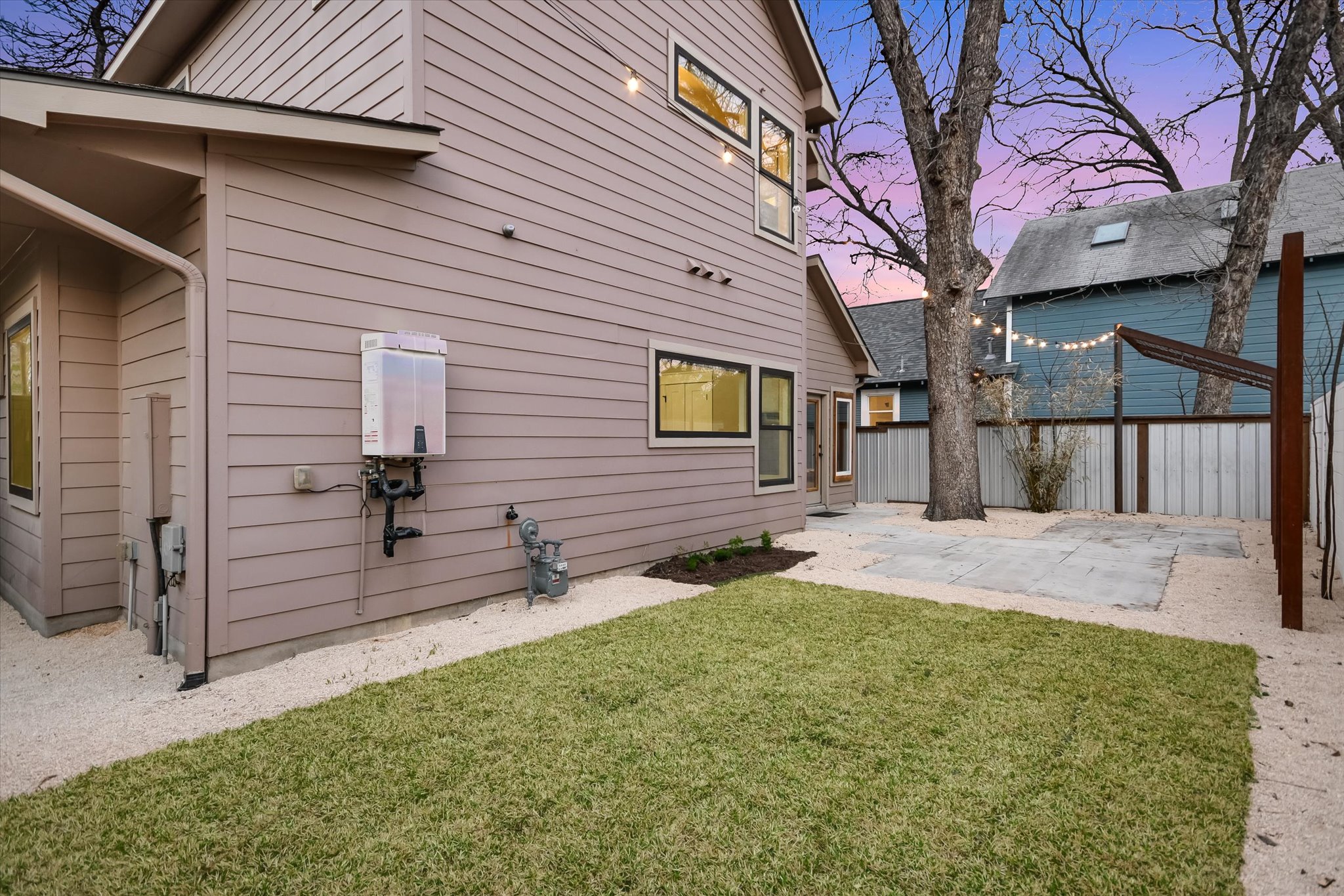 1613 Willow Street Austin, TX 78702 - Photo 26 of 30 a front view of a house with a yard