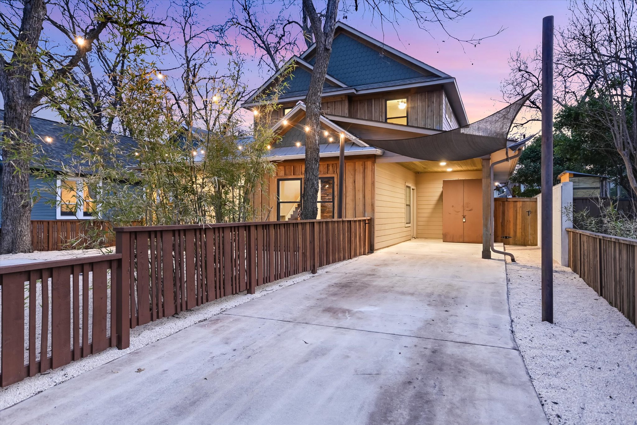 1613 Willow Street Austin, TX 78702 - Photo 27 of 30 a view of a house with a wooden fence