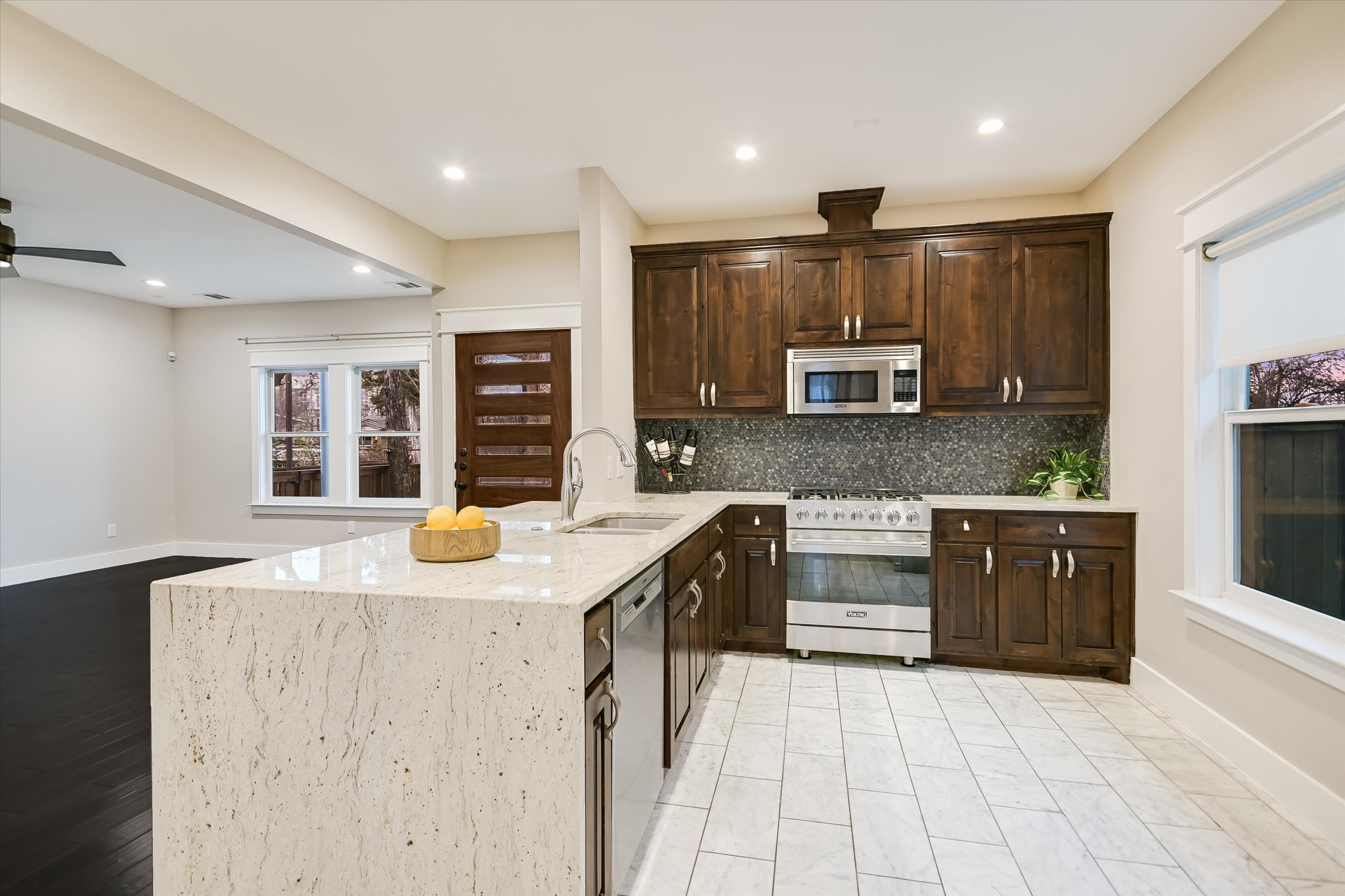 1613 Willow Street Austin, TX 78702 - Photo 7 of 30 a kitchen with granite countertop a sink and cabinets
