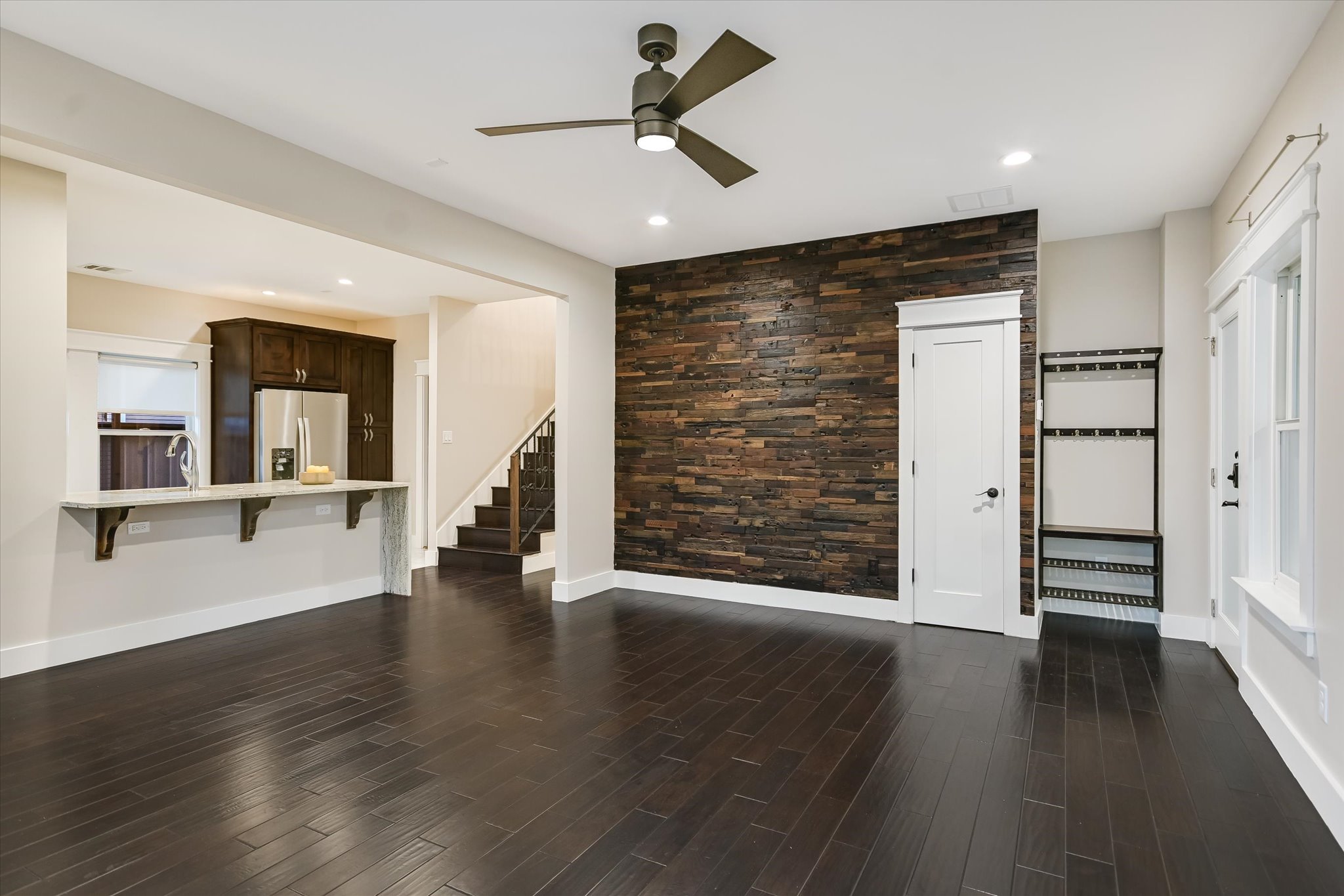1613 Willow Street Austin, TX 78702 - Photo 8 of 30 a view of an empty room with wooden floor and a window
