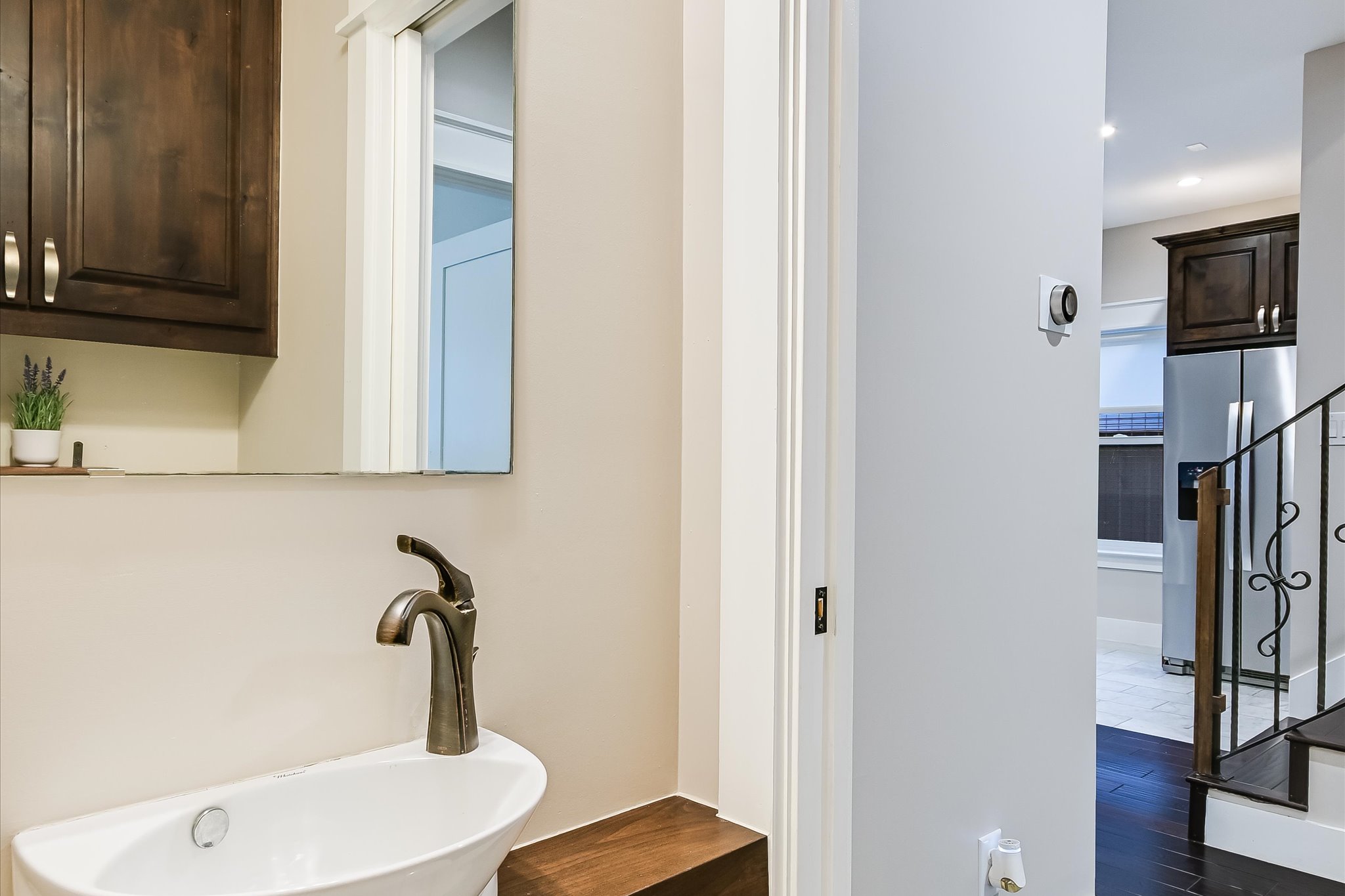 1613 Willow Street Austin, TX 78702 - Photo 10 of 30 a bathroom with a sink and mirror