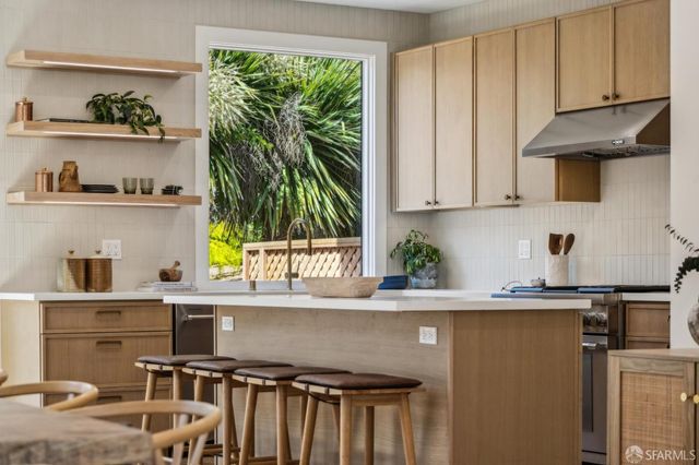a view of balcony with wooden floor and fence
