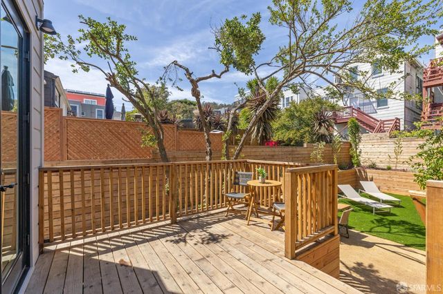 a view of a bench in a backyard