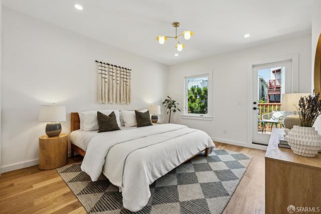 a view of balcony with chairs and wooden fence