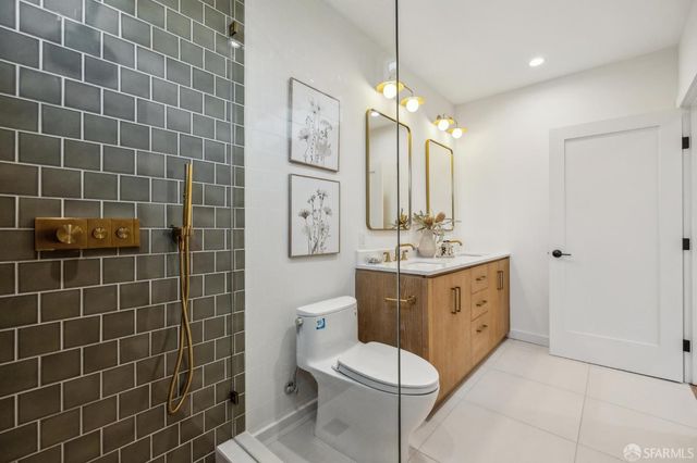 a bedroom with two beds and a large window