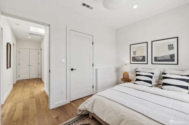 a view of a bedroom with washer and dryer