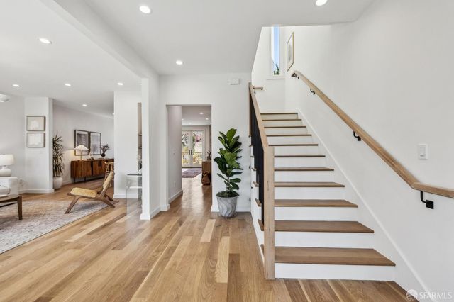 a living room with furniture rug and window